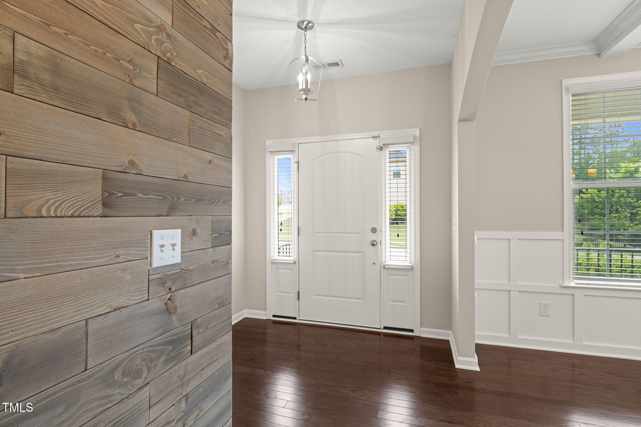 5011 Peachtree Town Lane Knightdale, NC 27545 - Photo 9 of 47 a view of empty room with wooden floor and fan
