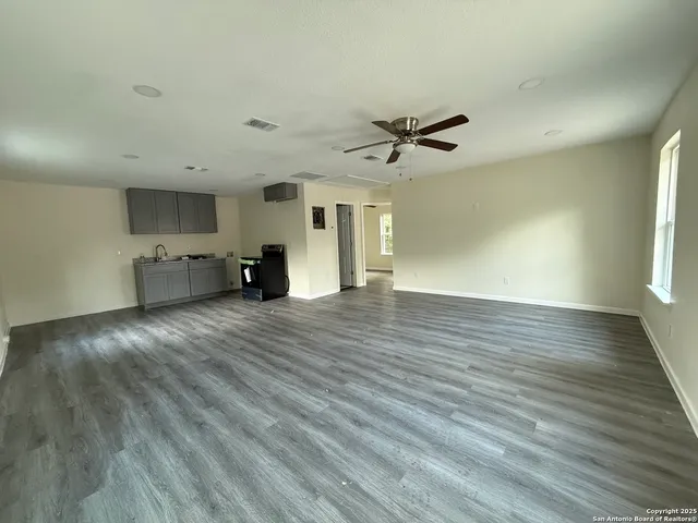 a view of a livingroom with furniture and wooden floor