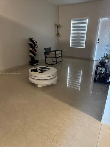 a living room with furniture and window