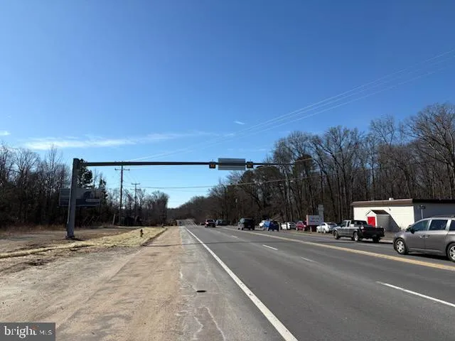 a view of car parked on the side of a road