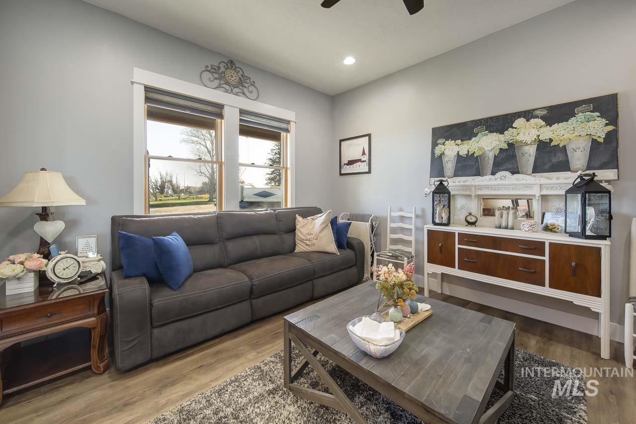 415 North Locust Grove Road Kuna, ID 83634 - Photo 21 of 49 Living area with dark wood-style flooring, recessed lighting, and ceiling fan