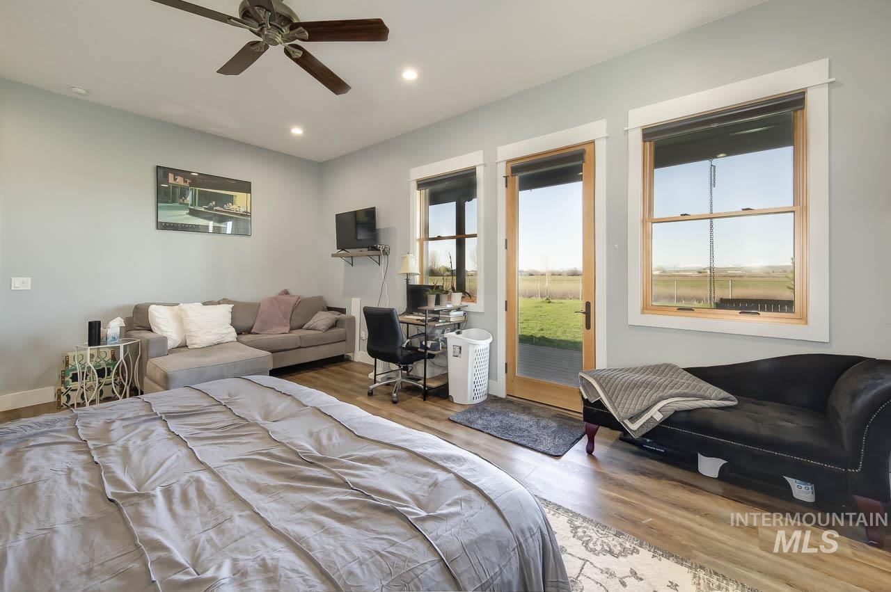 415 North Locust Grove Road Kuna, ID 83634 - Photo 32 of 49 Bedroom with wood finished floors, multiple windows, recessed lighting, a desk, and ceiling fan