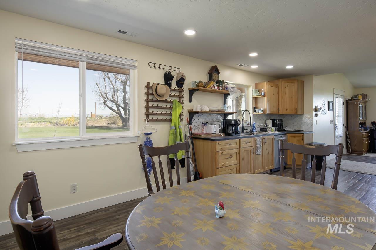 415 North Locust Grove Road Kuna, ID 83634 - Photo 43 of 49 Dining area featuring healthy amount of natural light, dark wood-style floors, and recessed lighting