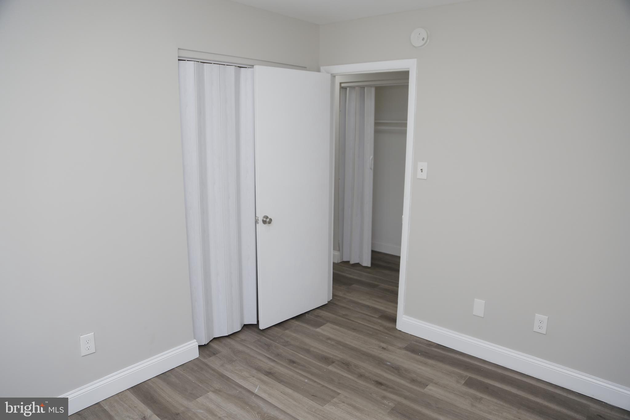 4209 Ridgewood Avenue, Unit 4 Baltimore, MD 21215 - Photo 14 of 17 a view of a hallway with wooden floor