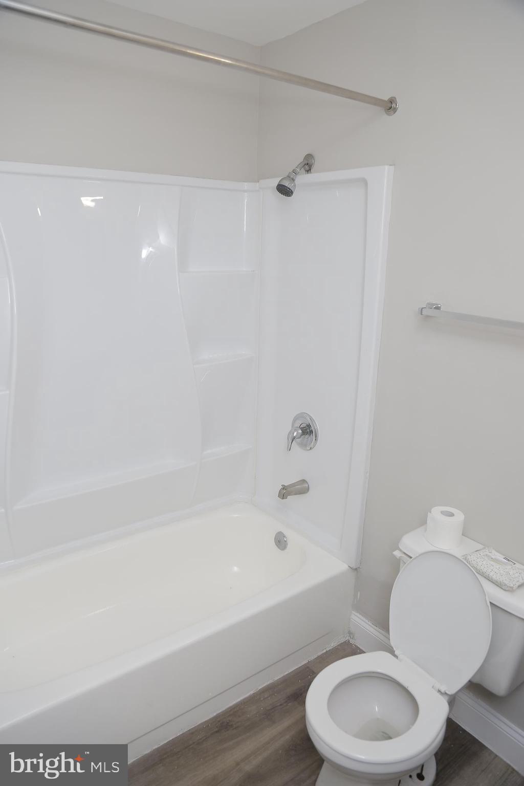 4209 Ridgewood Avenue, Unit 4 Baltimore, MD 21215 - Photo 16 of 17 a bathroom with a toilet and a bathtub