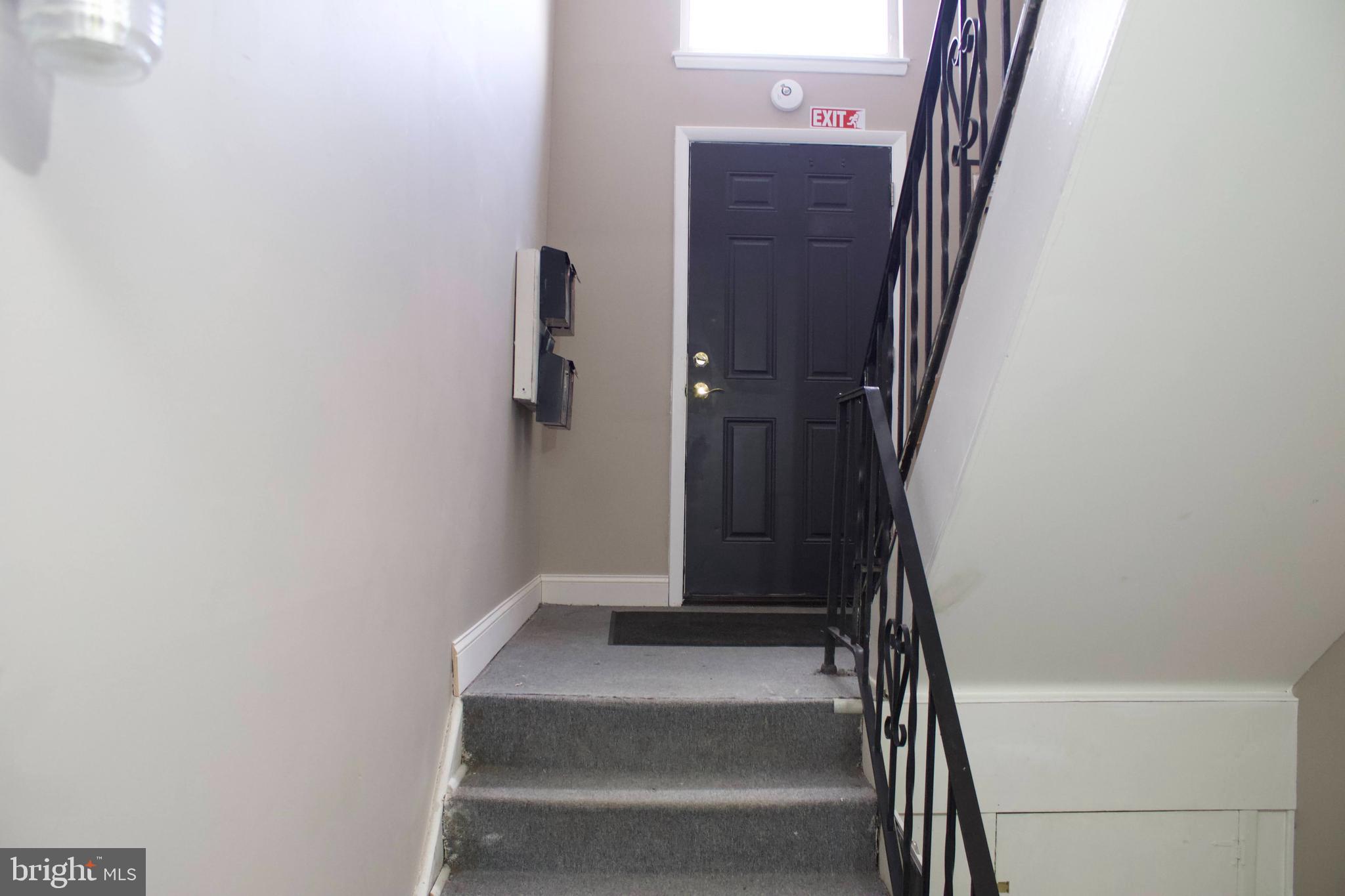 4209 Ridgewood Avenue, Unit 4 Baltimore, MD 21215 - Photo 9 of 17 a view of staircase with white walls