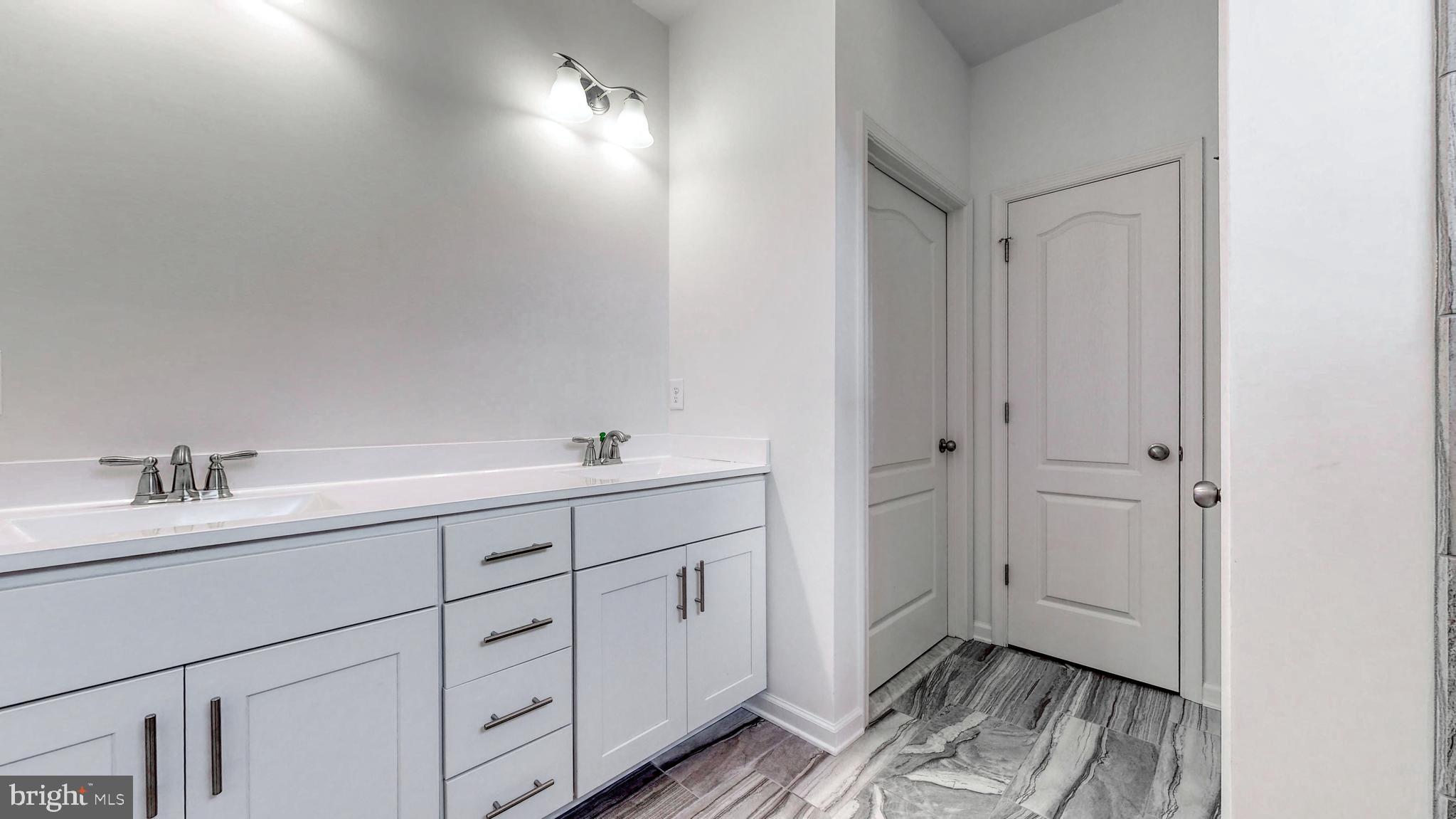 1 Wilson Hill Road Georgetown, DE 19947 - Photo 15 of 36 a bathroom with a sink and a mirror