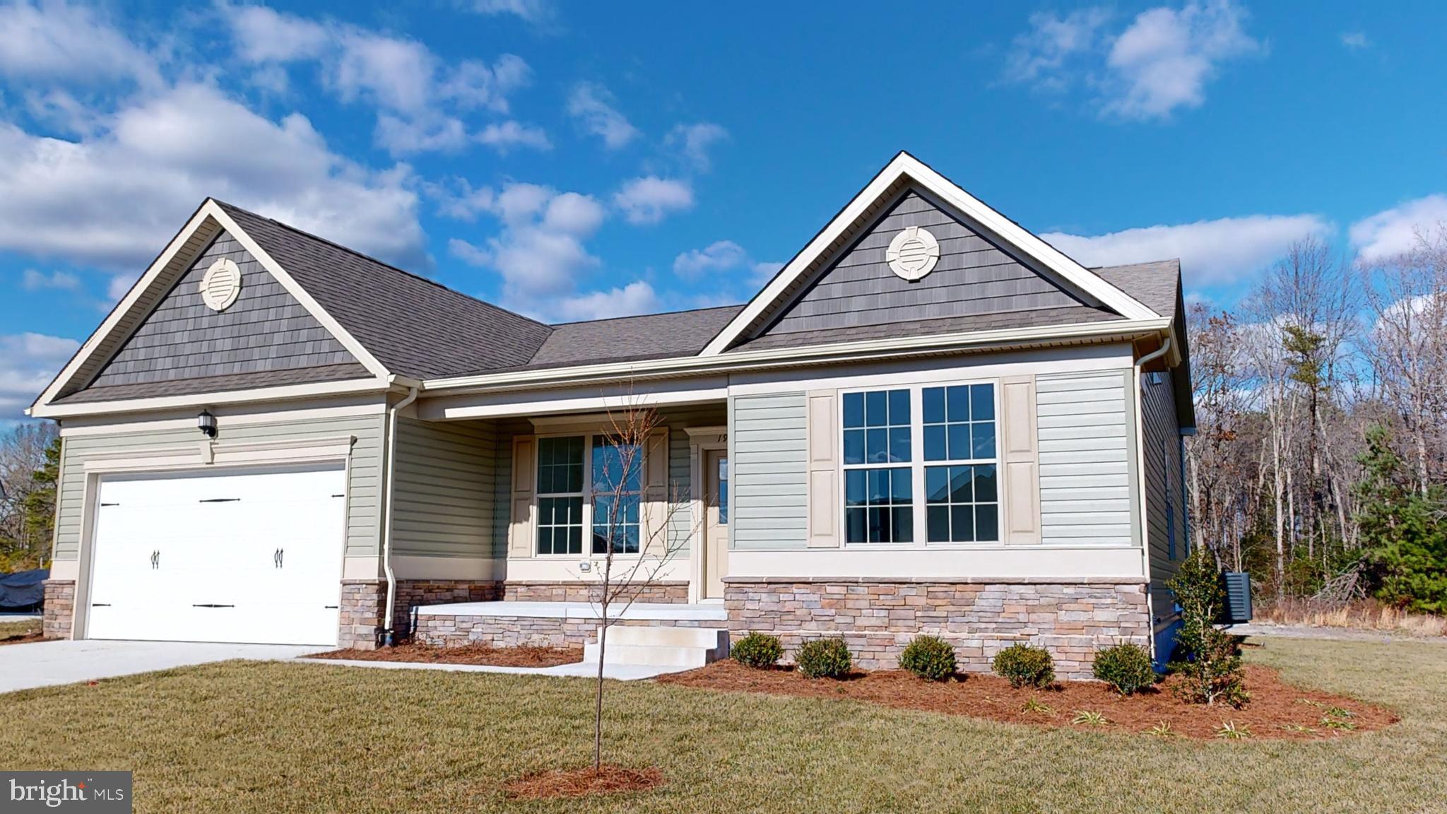 1 Wilson Hill Road Georgetown, DE 19947 - Photo 2 of 36 a front view of a house with a yard and garage