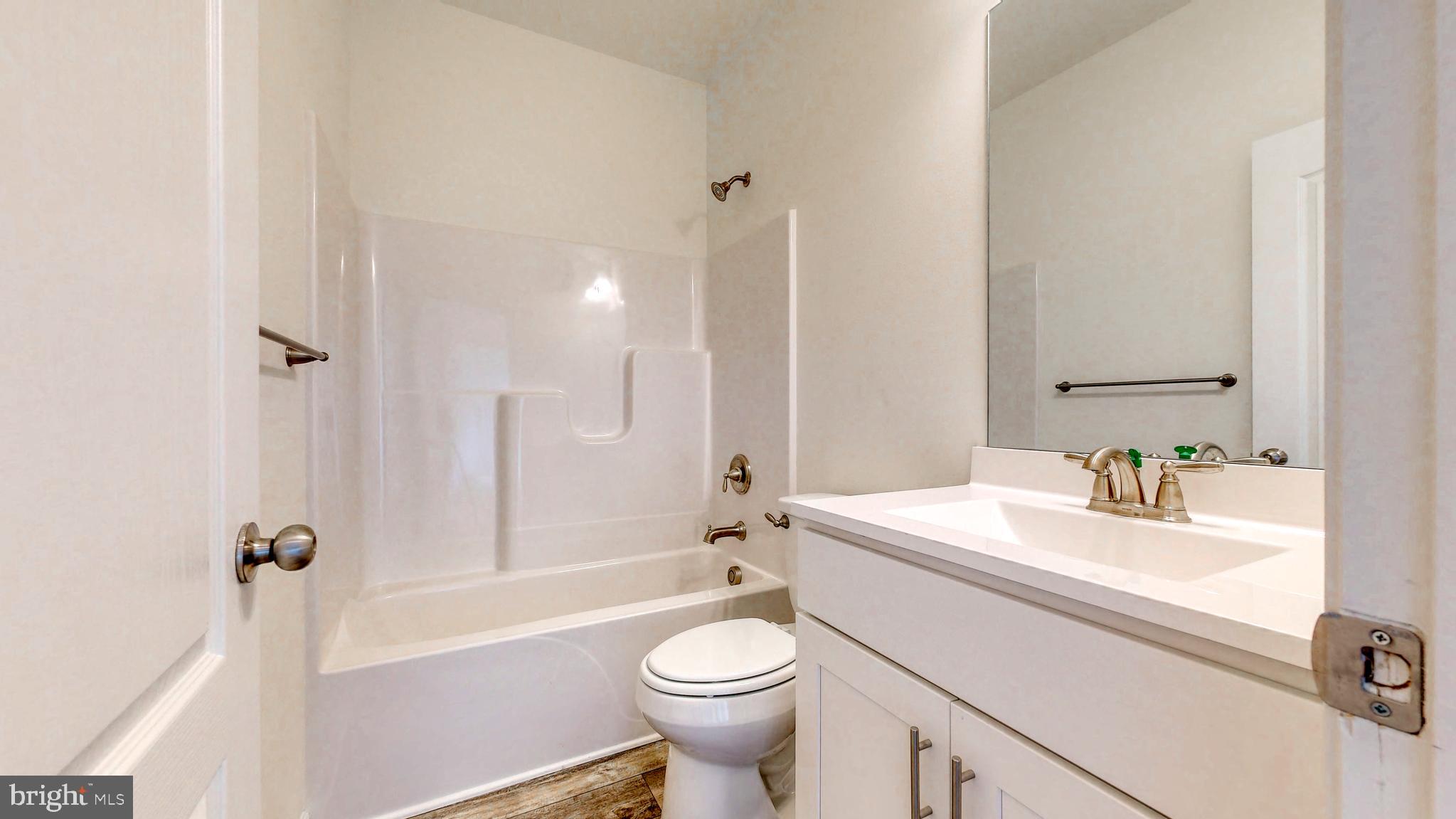 1 Wilson Hill Road Georgetown, DE 19947 - Photo 26 of 36 a bathroom with a sink a toilet and shower