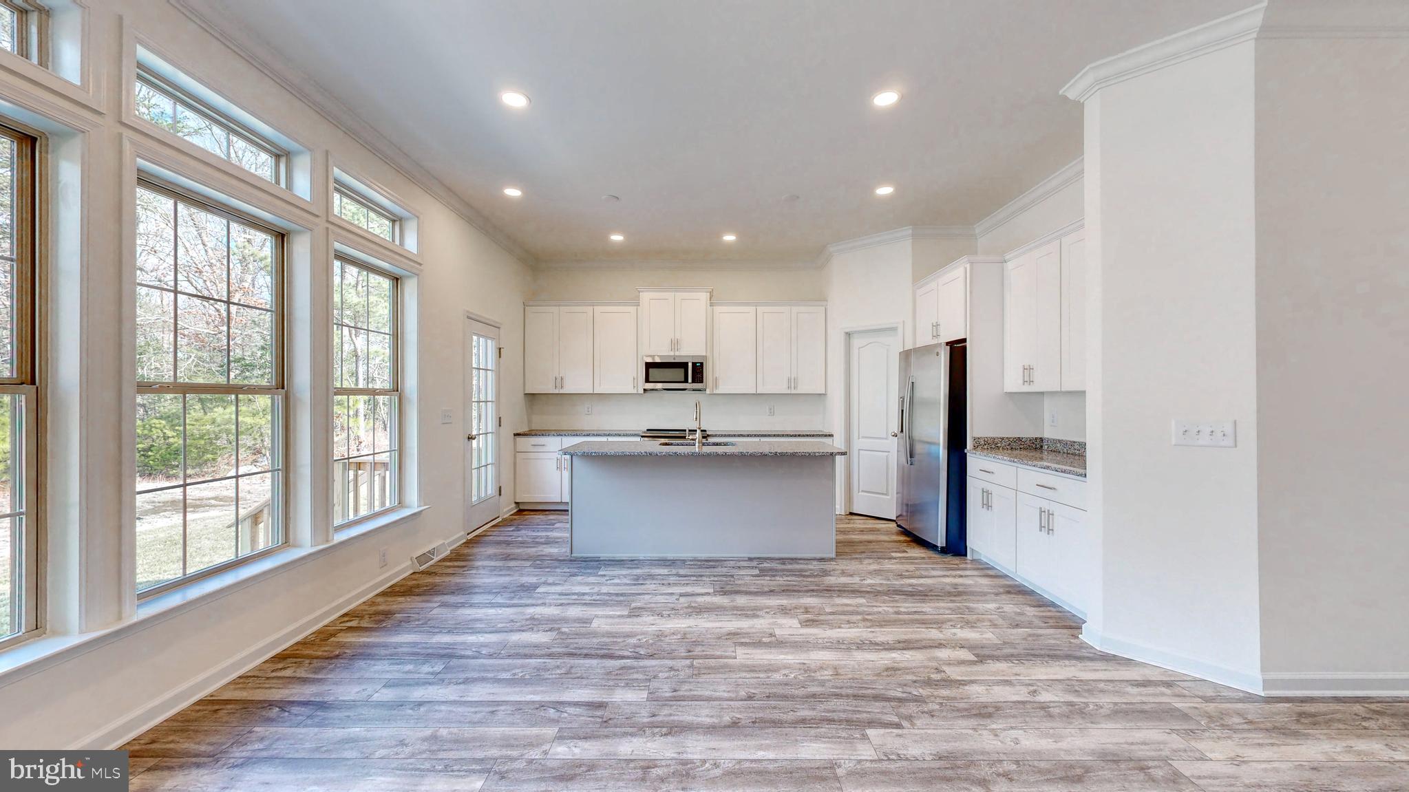 1 Wilson Hill Road Georgetown, DE 19947 - Photo 10 of 36 a large kitchen with a large window and stainless steel appliances