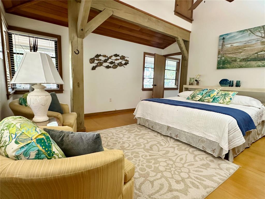 7475 Manasota Key Road Englewood, FL 34223 - Photo 43 of 79 a bedroom with a bed and a couch