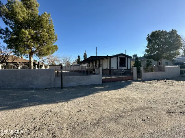 a view of a backyard of the house