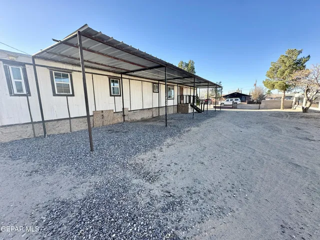 a view of a backyard of the house