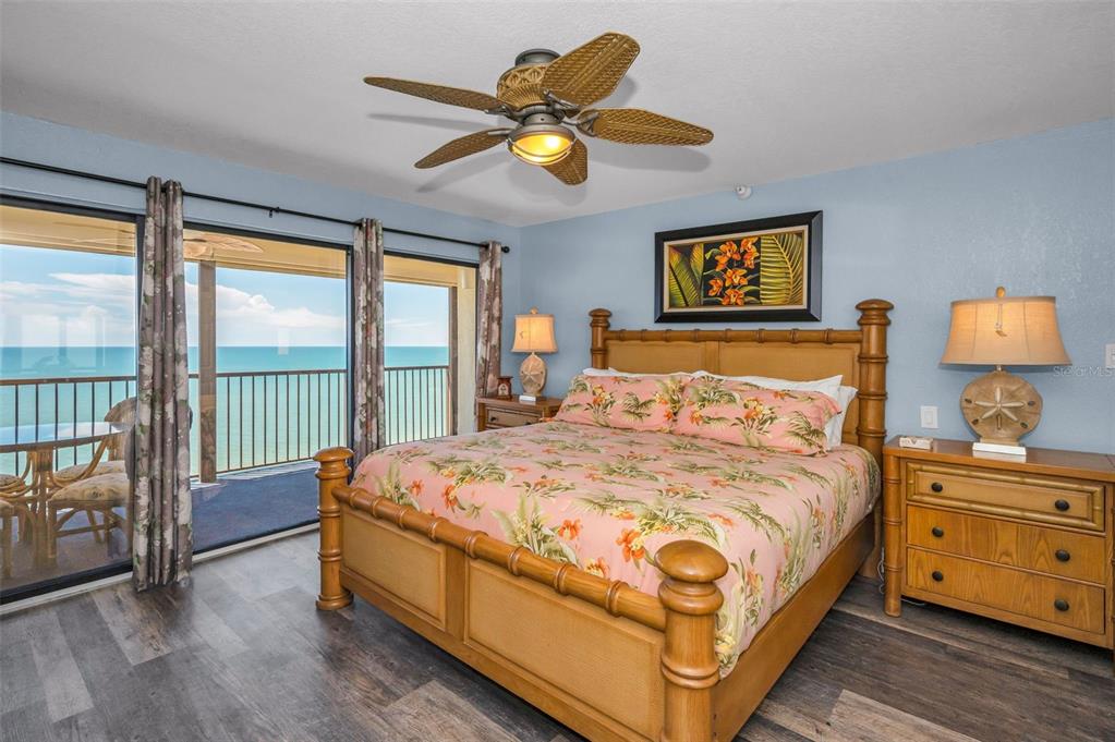 14950 Gulf Boulevard, Unit 1206 Madeira Beach, FL 33708 - Photo 19 of 69 a bedroom with a bed and a large window