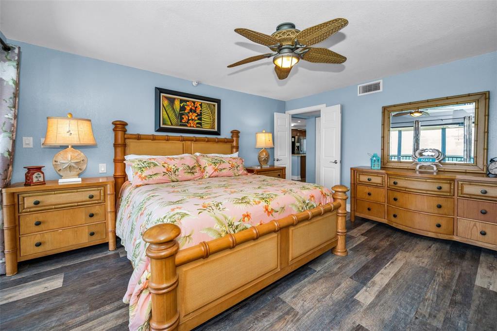 14950 Gulf Boulevard, Unit 1206 Madeira Beach, FL 33708 - Photo 20 of 69 a bedroom with a bed and a dresser