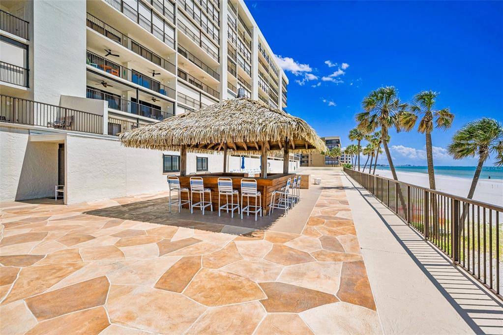 14950 Gulf Boulevard, Unit 1206 Madeira Beach, FL 33708 - Photo 46 of 69 a view of a patio with swimming pool