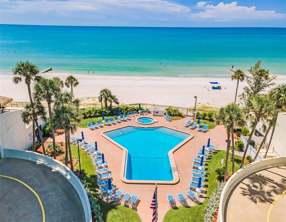 14950 Gulf Boulevard, Unit 1206 Madeira Beach, FL 33708 - Photo 47 of 69 a view of a swimming pool with an outdoor seating