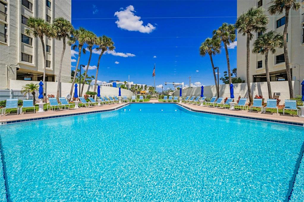 14950 Gulf Boulevard, Unit 1206 Madeira Beach, FL 33708 - Photo 50 of 69 a view of a swimming pool with an outdoor seating