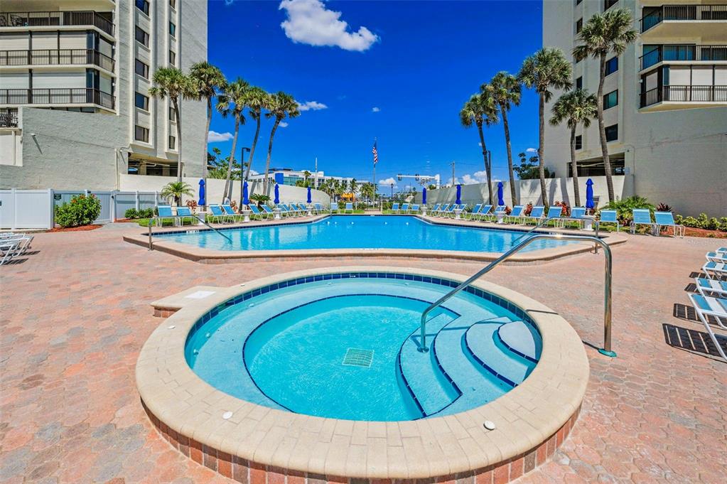 14950 Gulf Boulevard, Unit 1206 Madeira Beach, FL 33708 - Photo 56 of 69 a view of a swimming pool with outdoor seating