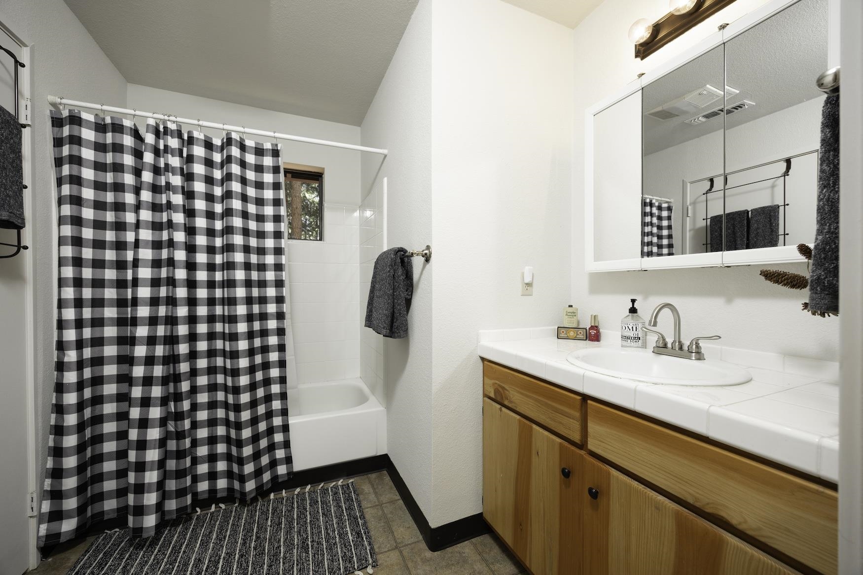 41080 Putt Road Emigrant Gap, CA 95715 - Photo 11 of 21 a bathroom with a sink and a mirror