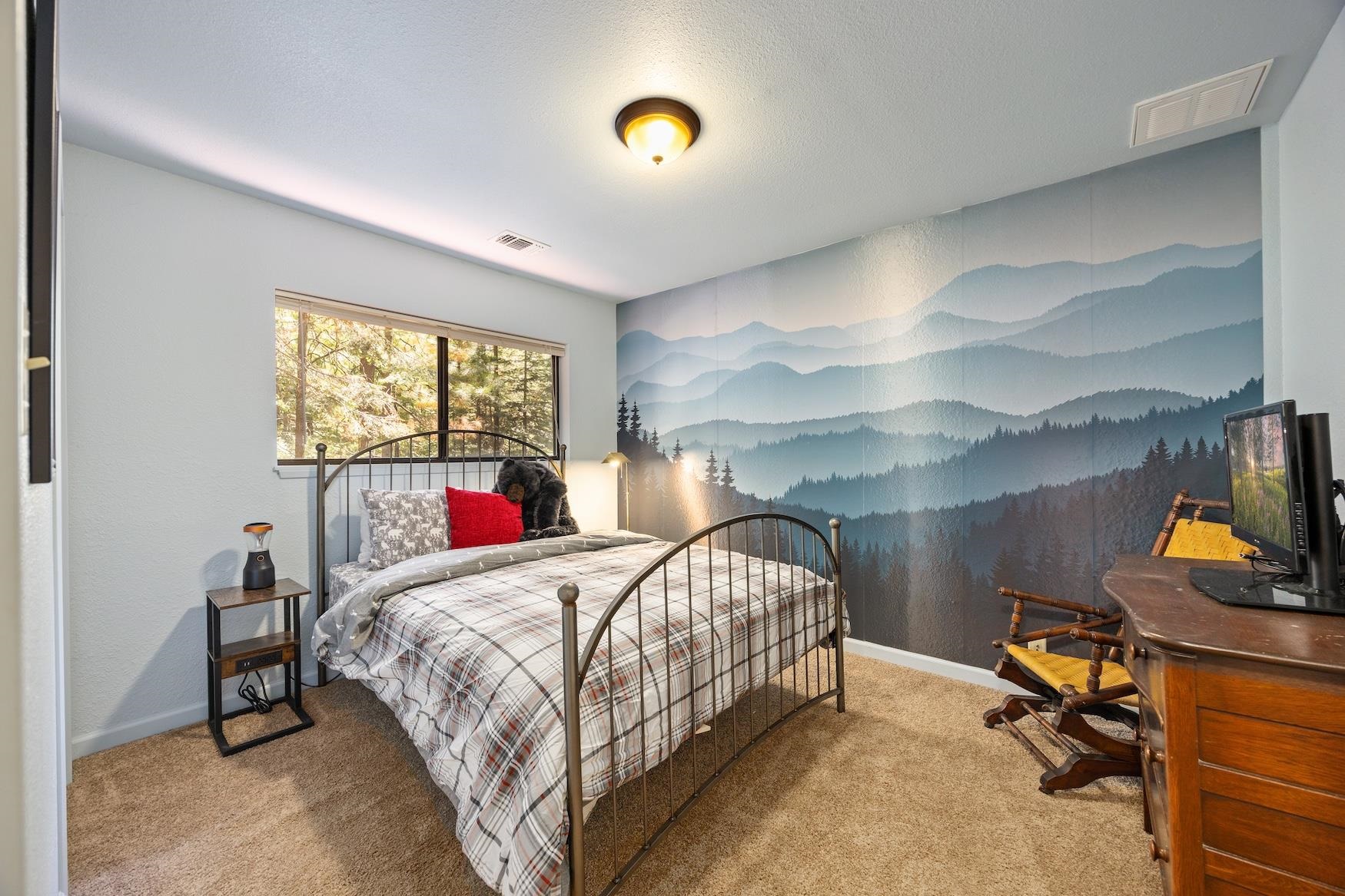 41080 Putt Road Emigrant Gap, CA 95715 - Photo 12 of 21 a bedroom with a bed and a window