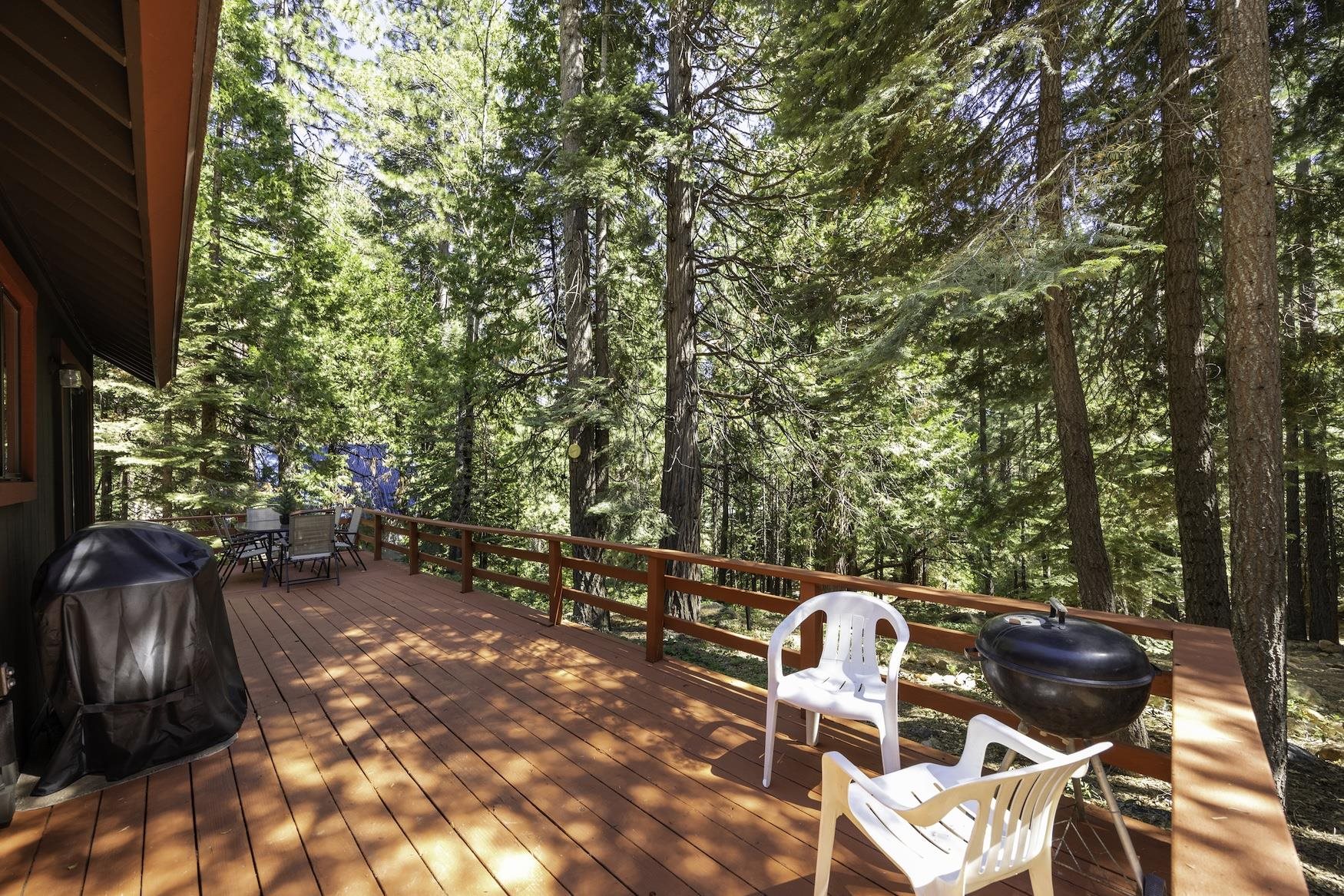 41080 Putt Road Emigrant Gap, CA 95715 - Photo 15 of 21 a backyard of a house with table and chairs