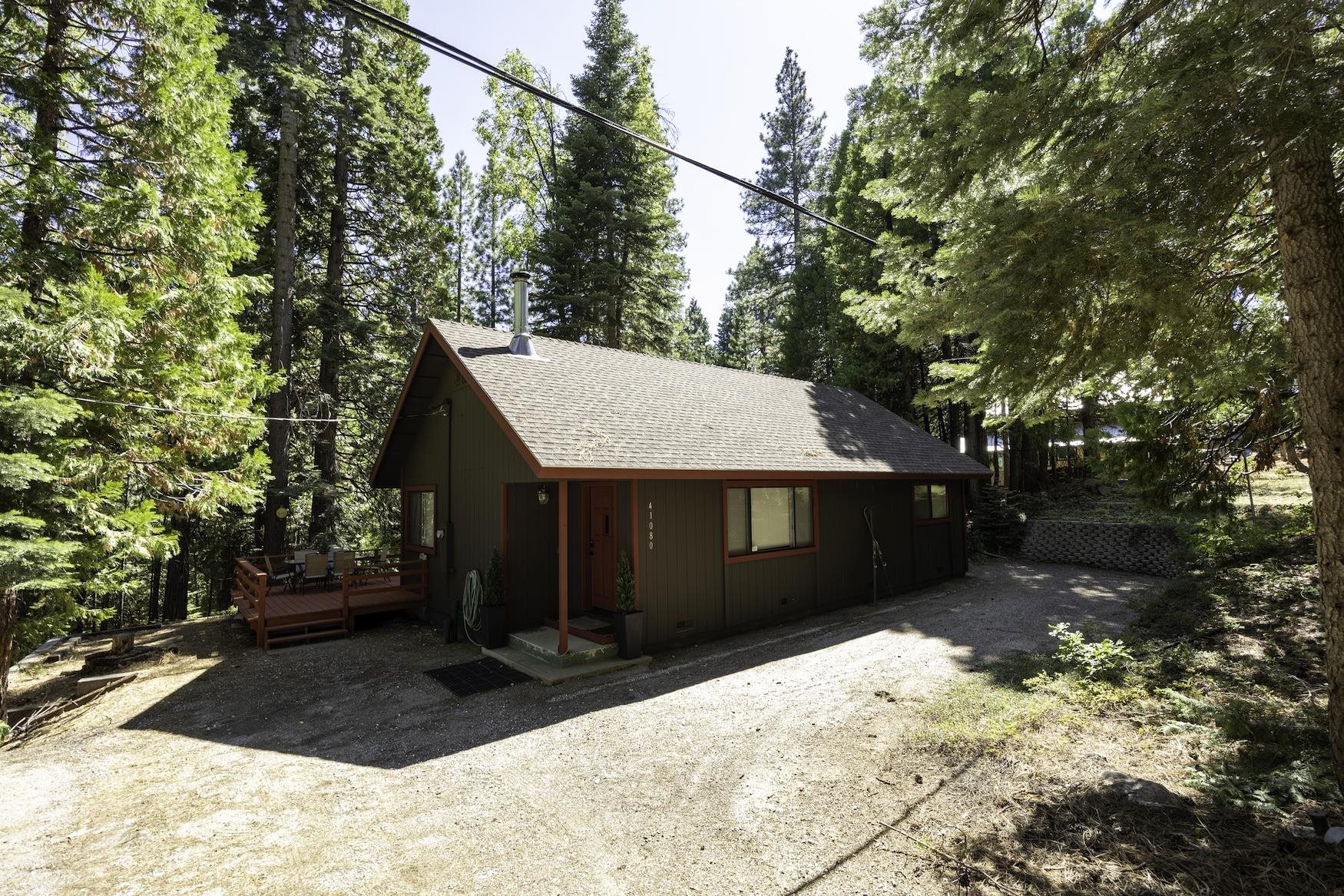 41080 Putt Road Emigrant Gap, CA 95715 - Photo 21 of 21 a view of a house with a yard covered in snow