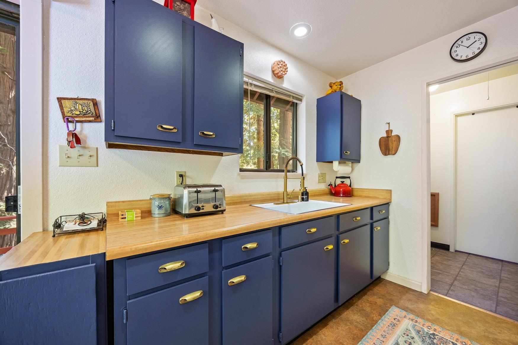 41080 Putt Road Emigrant Gap, CA 95715 - Photo 5 of 21 a kitchen with a sink and a cabinets