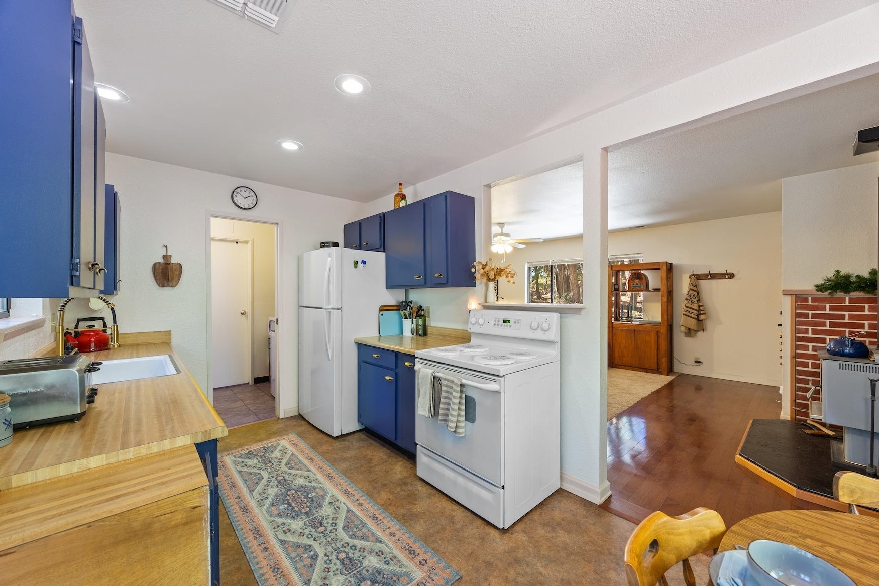 41080 Putt Road Emigrant Gap, CA 95715 - Photo 6 of 21 a kitchen with stainless steel appliances granite countertop a refrigerator and a stove top oven