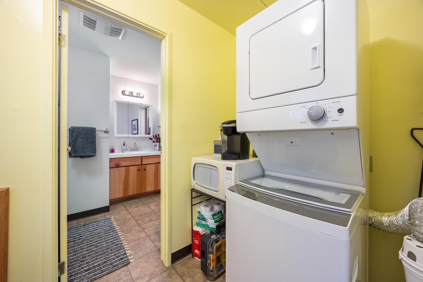 41080 Putt Road Emigrant Gap, CA 95715 - Photo 9 of 21 a utility room with cabinets washer and dryer