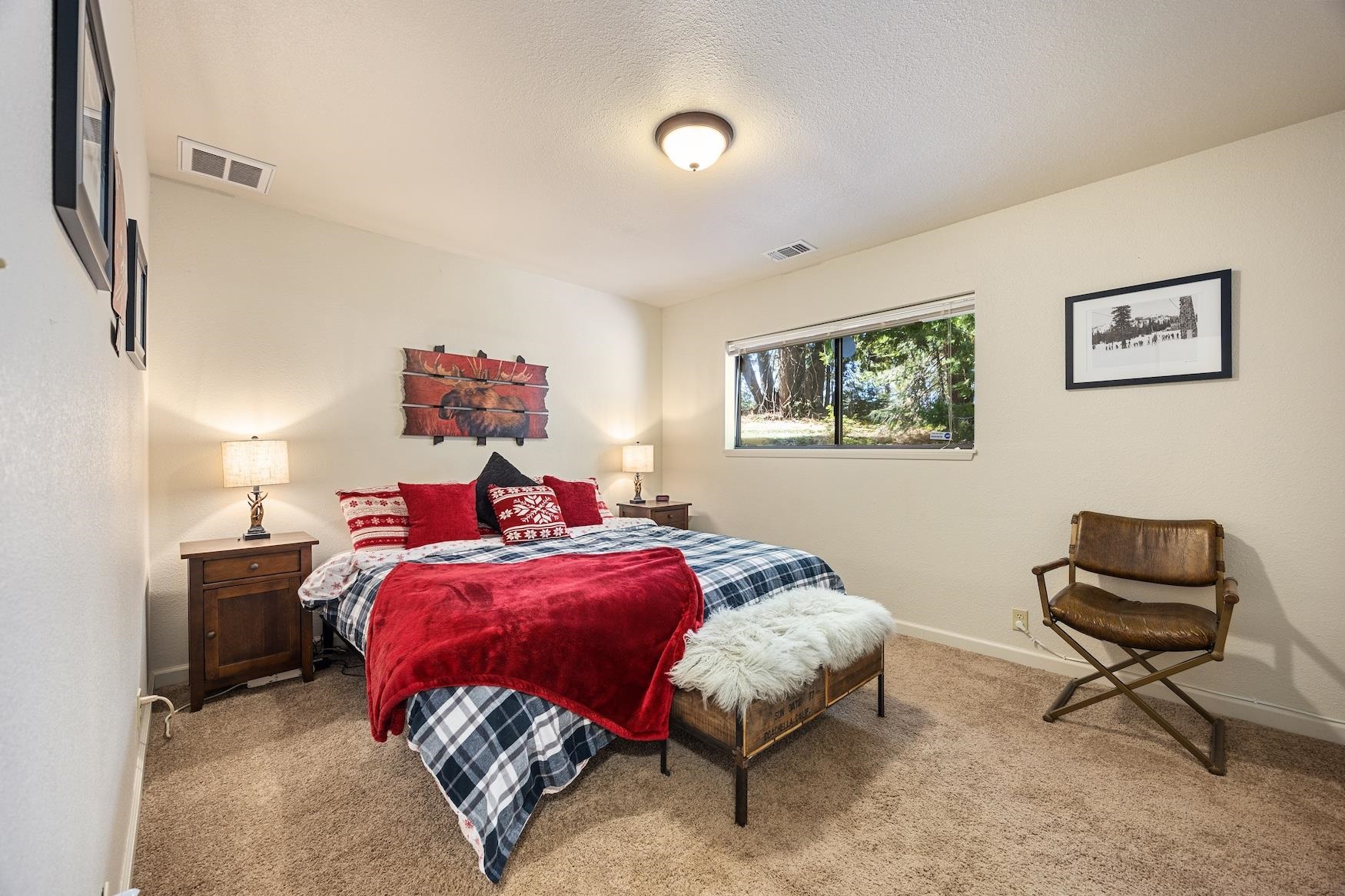 41080 Putt Road Emigrant Gap, CA 95715 - Photo 10 of 21 a bed room with a bed and a chair