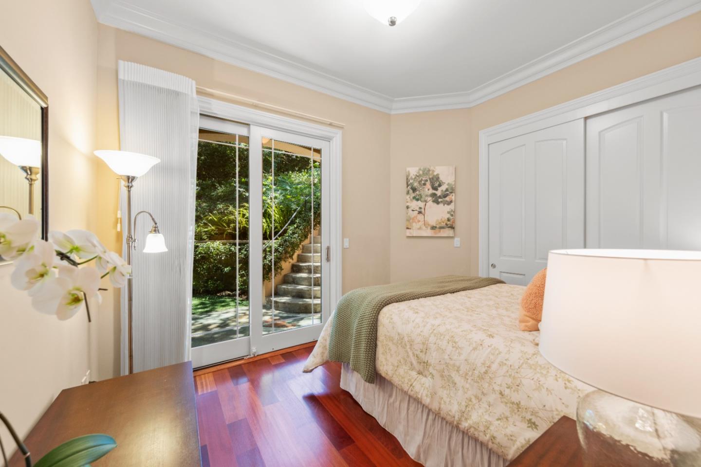 10495 Scenic Boulevard Cupertino, CA 95014 - Photo 14 of 30 a bedroom with a large bed and a large window