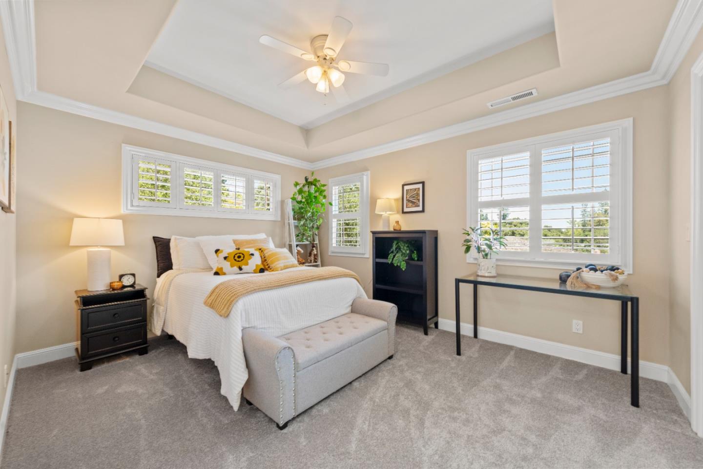 10495 Scenic Boulevard Cupertino, CA 95014 - Photo 18 of 30 a bedroom with a bed and a chandelier