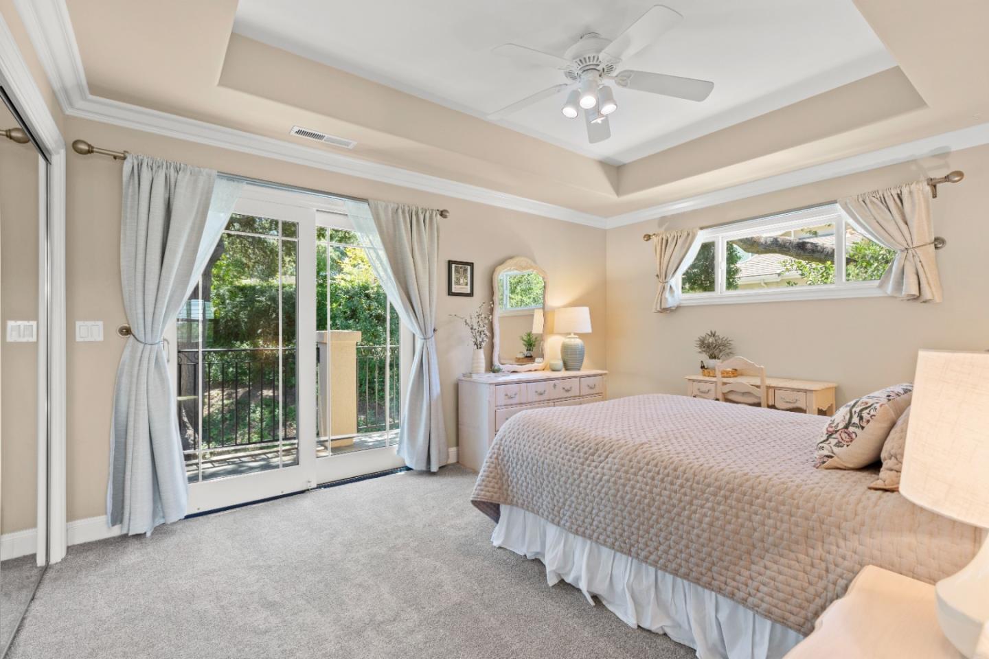 10495 Scenic Boulevard Cupertino, CA 95014 - Photo 20 of 30 a bedroom with a bed and a large window