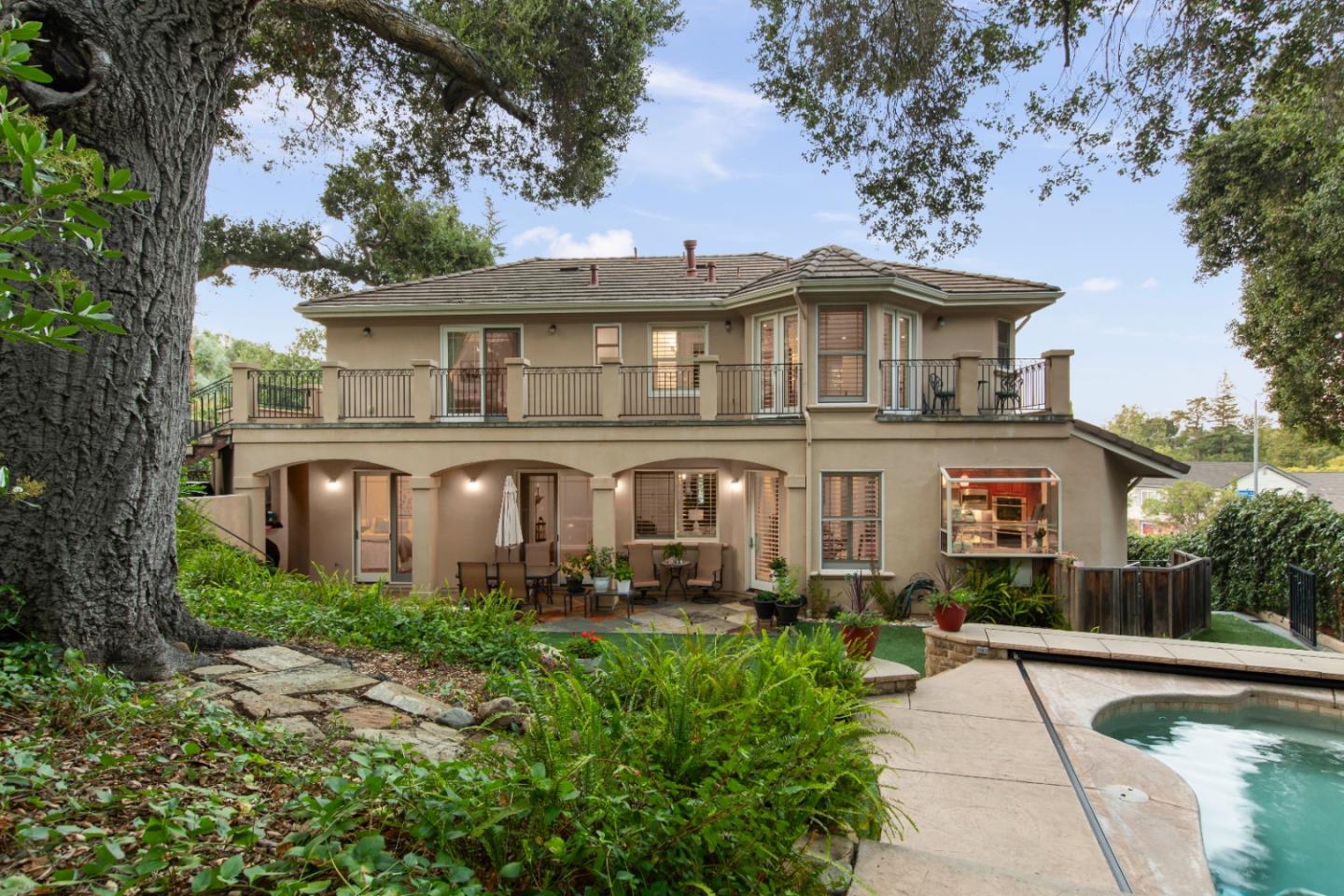 10495 Scenic Boulevard Cupertino, CA 95014 - Photo 21 of 30 a front view of a house with garden