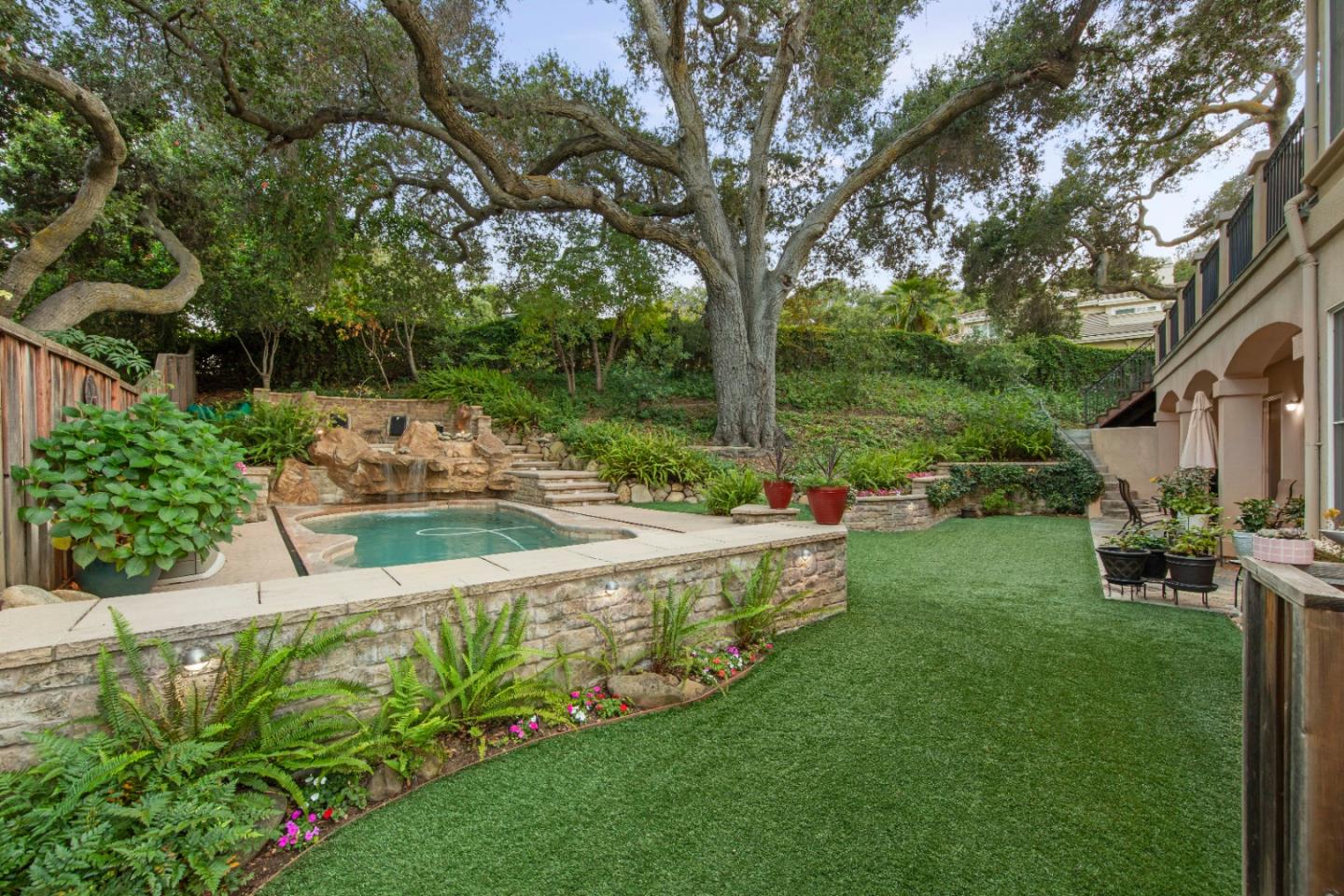 10495 Scenic Boulevard Cupertino, CA 95014 - Photo 22 of 30 a view of a garden with an outdoor seating