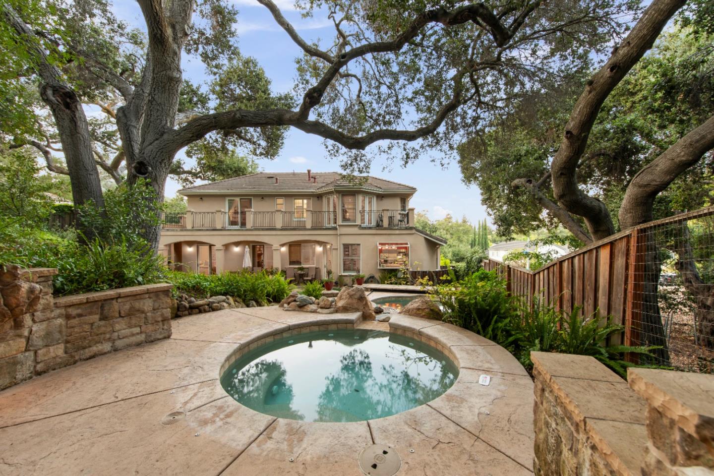 10495 Scenic Boulevard Cupertino, CA 95014 - Photo 23 of 30 a front view of a house with a garden