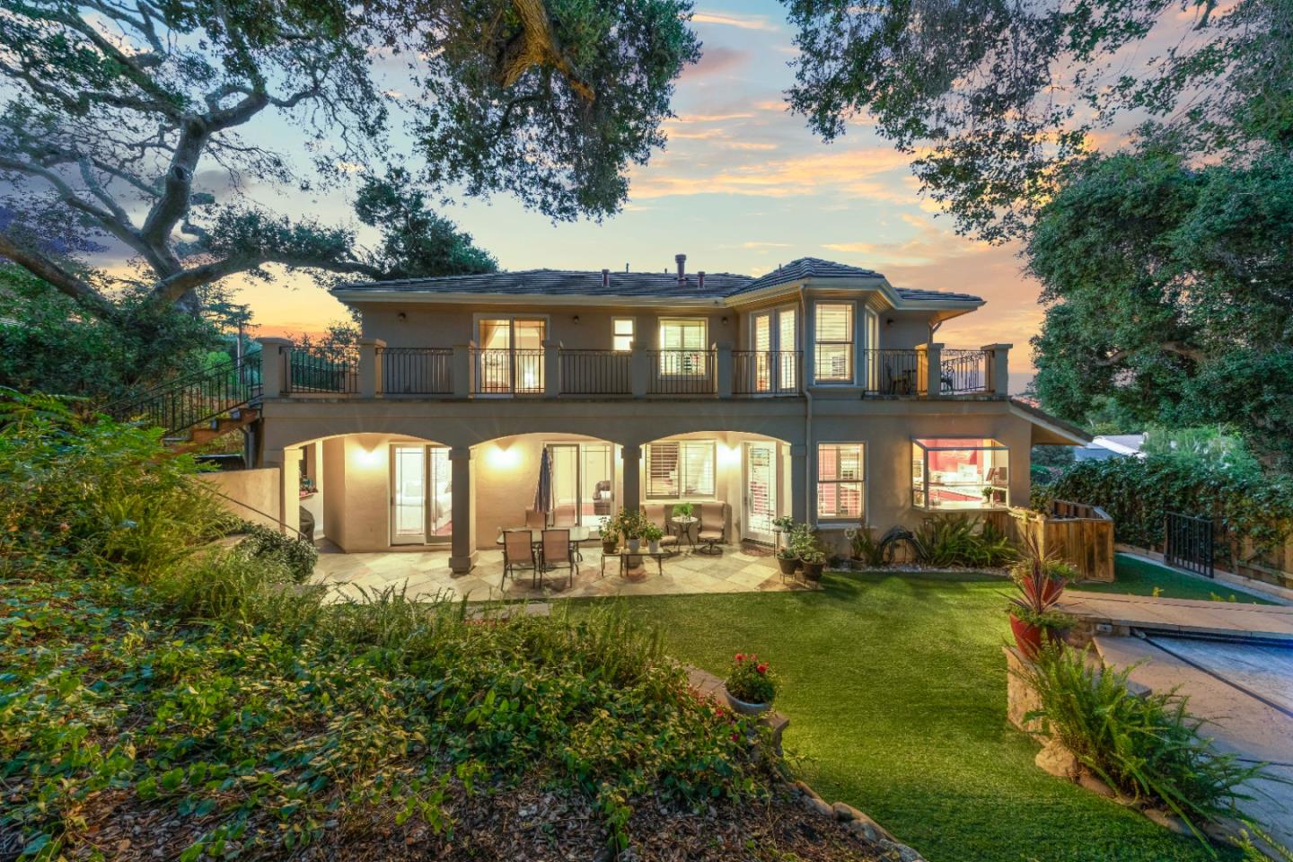 10495 Scenic Boulevard Cupertino, CA 95014 - Photo 26 of 30 a front view of a house with a yard table and chairs