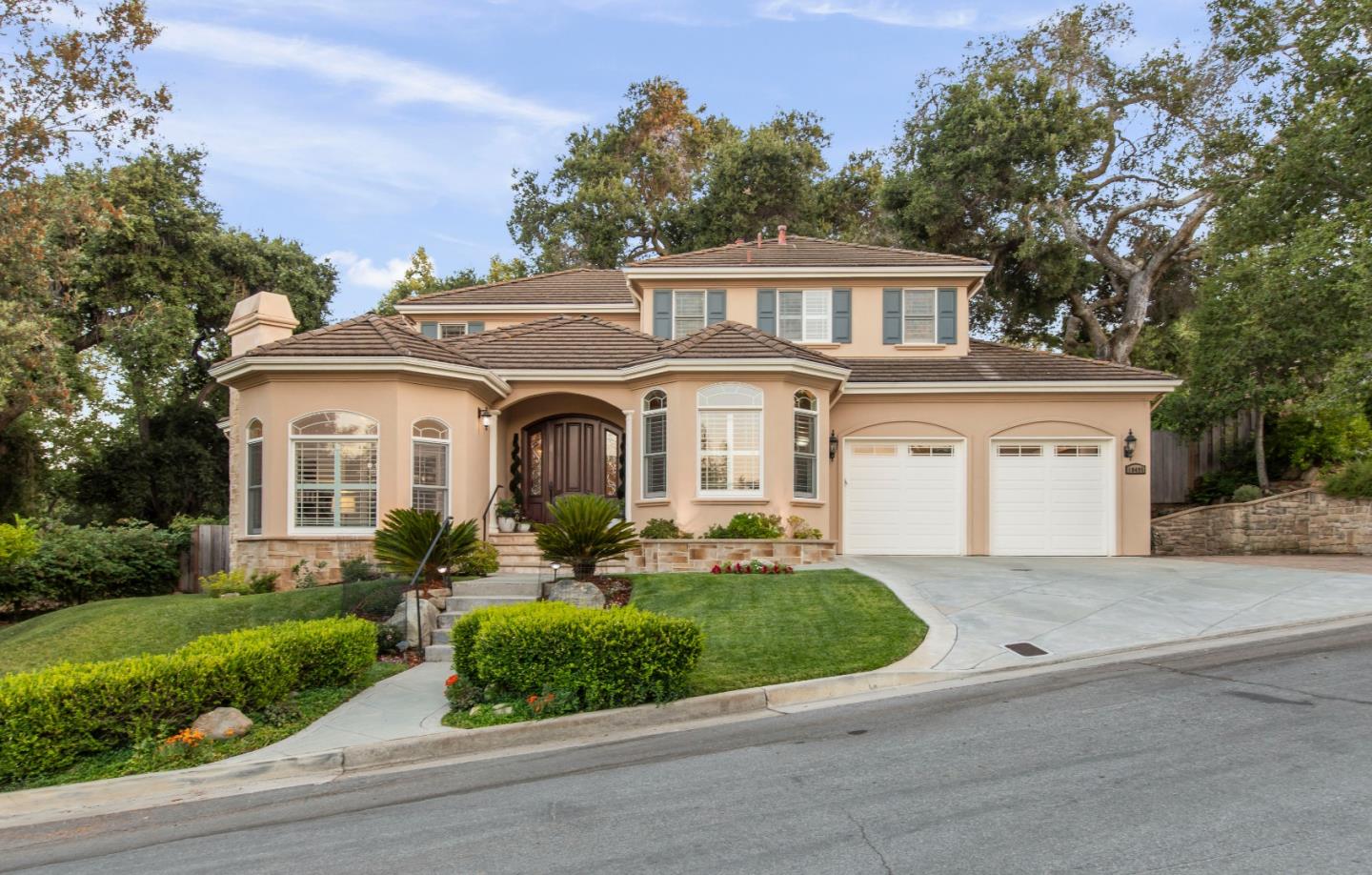 10495 Scenic Boulevard Cupertino, CA 95014 - Photo 27 of 30 a front view of a house with a yard and potted plants