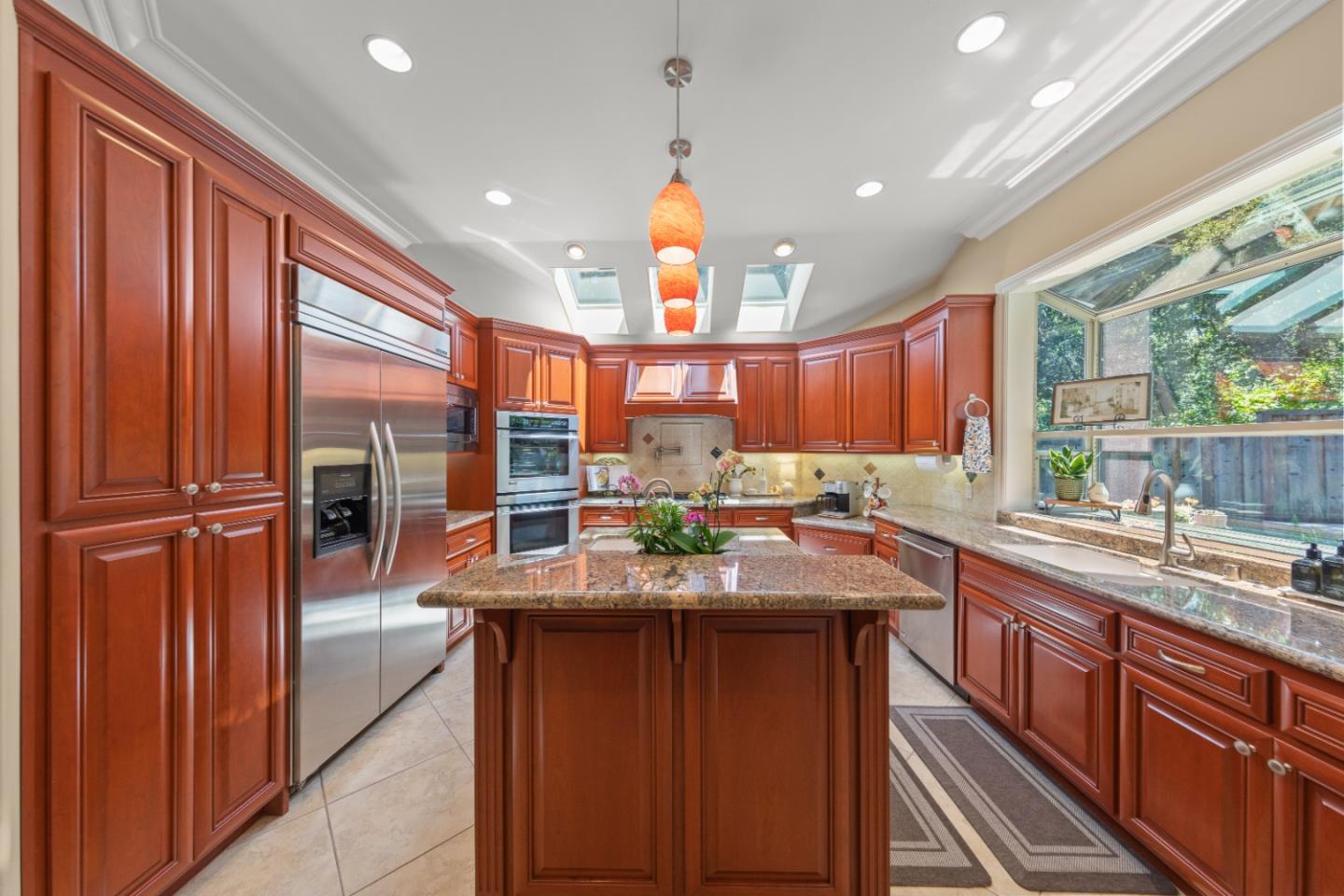 10495 Scenic Boulevard Cupertino, CA 95014 - Photo 7 of 30 a kitchen with stainless steel appliances granite countertop a sink and a refrigerator