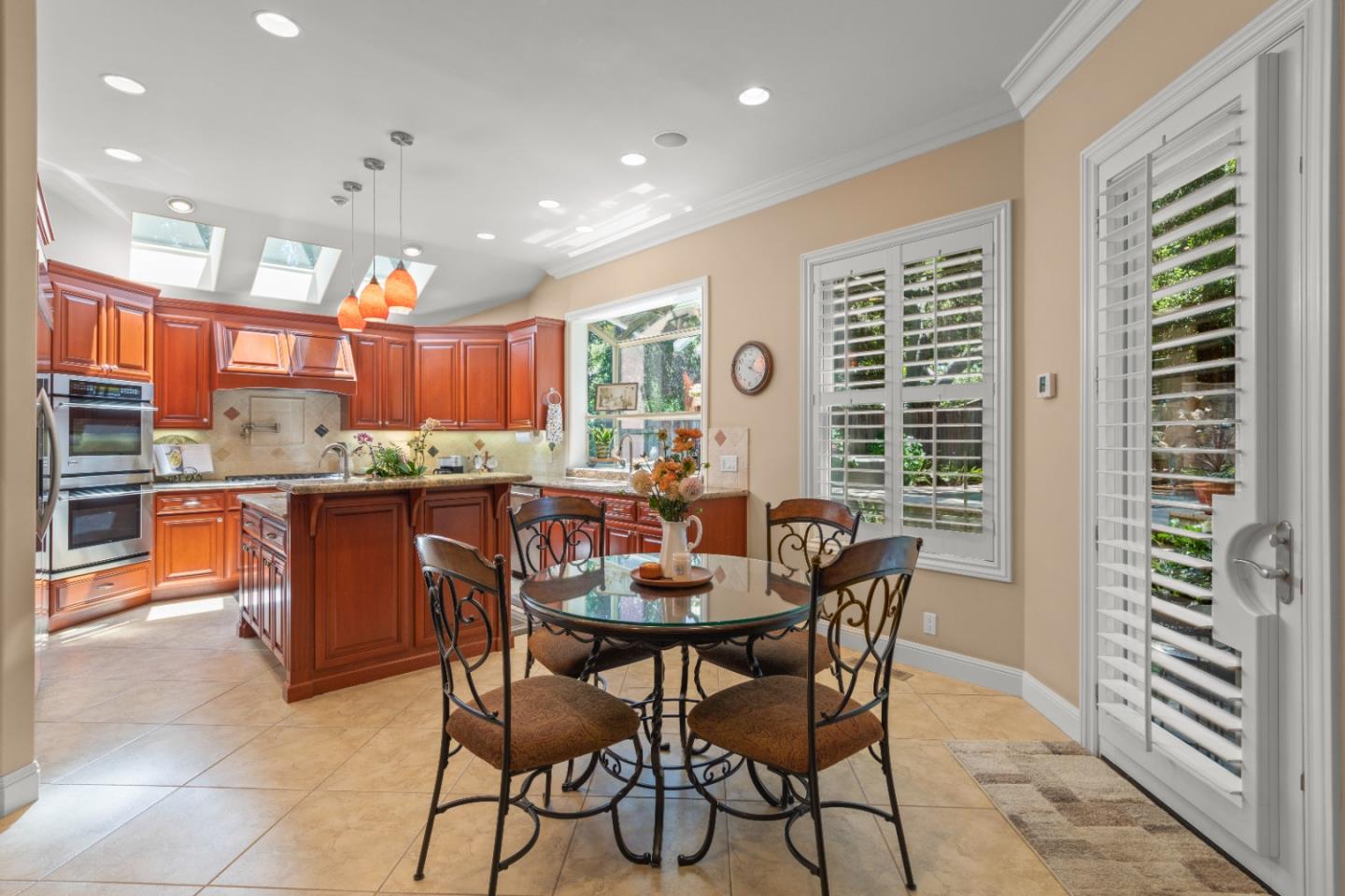 10495 Scenic Boulevard Cupertino, CA 95014 - Photo 8 of 30 a kitchen with a table and chairs in it