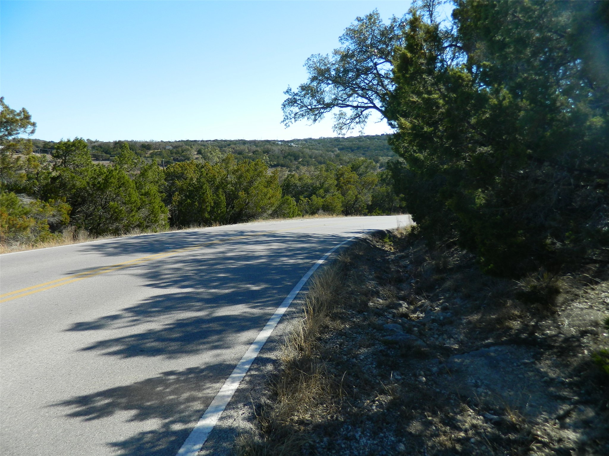 5100 Outpost Trace Leander, TX 78645 - Photo 2 of 6 a wooden bench with view of trees