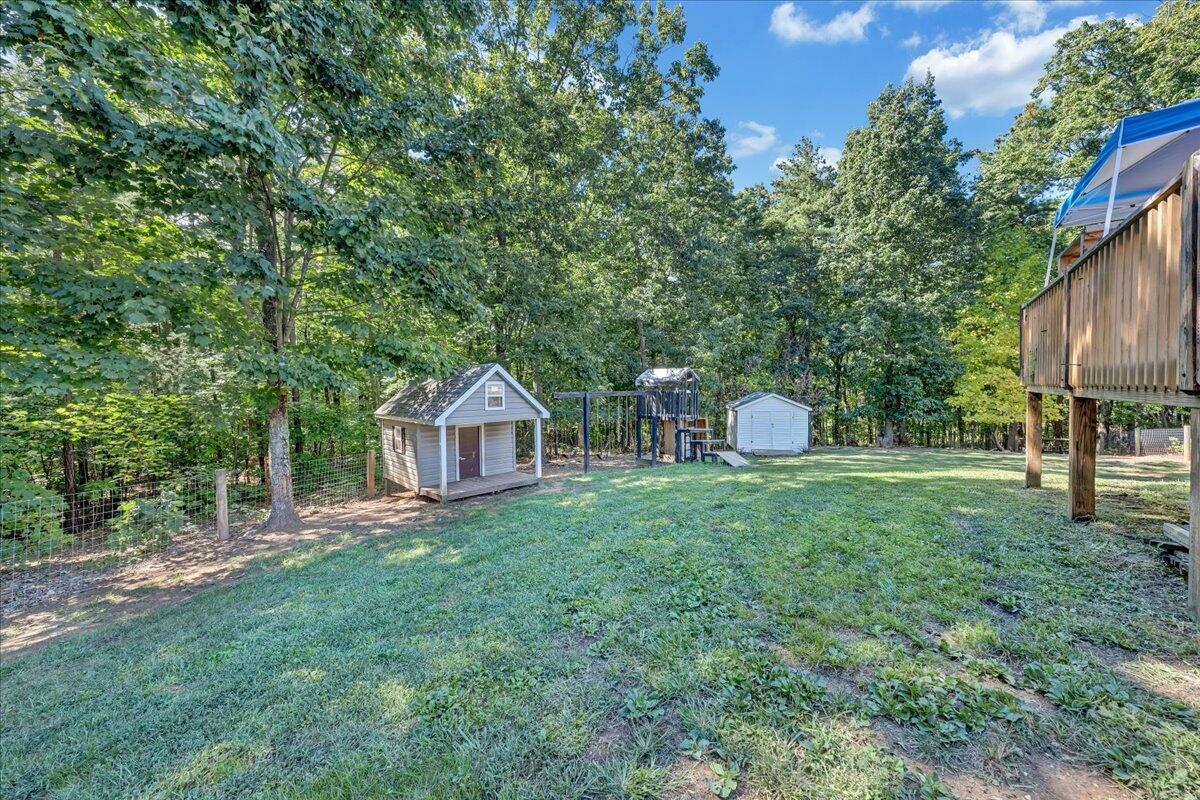 485 Foothills Road Callaway, VA 24067 - Photo 36 of 39 a front view of a house with a yard and trees