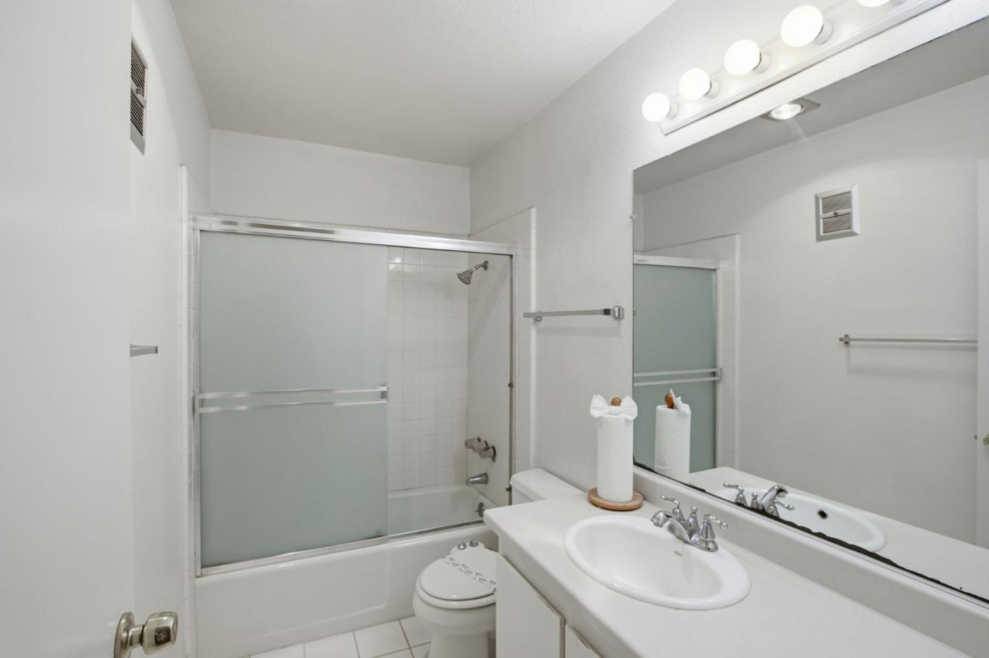 305 Tradewinds Drive, Unit 5 San Jose, CA 95123 - Photo 12 of 24 a bathroom with a sink toilet and shower