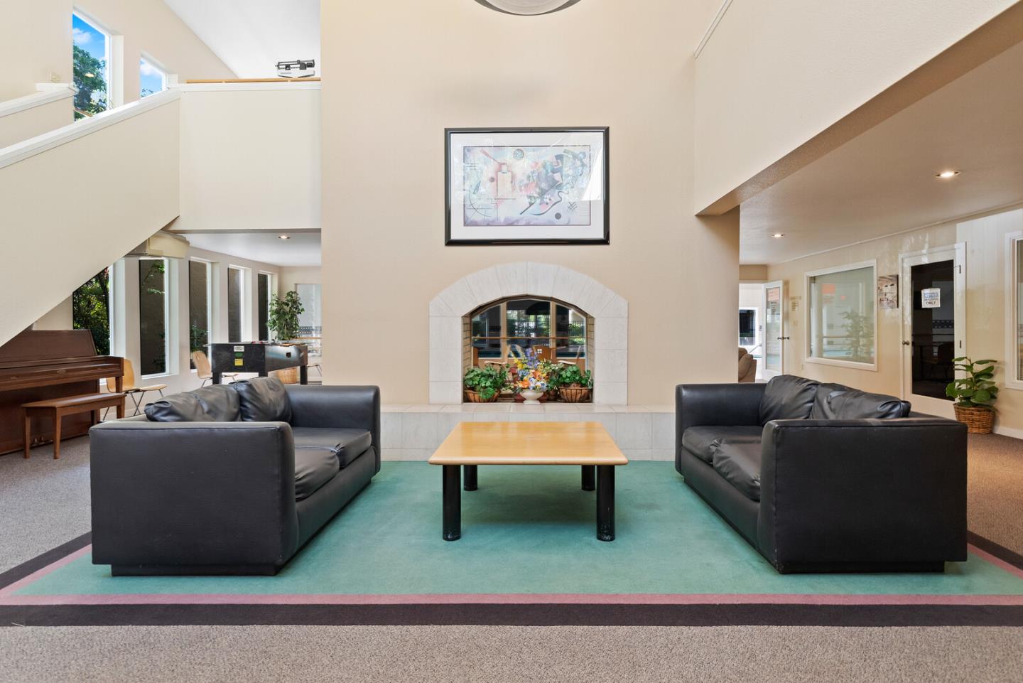305 Tradewinds Drive, Unit 5 San Jose, CA 95123 - Photo 21 of 24 a living room with furniture and a wooden floor