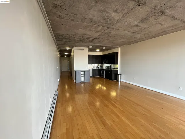 a view of hallway with wooden floor