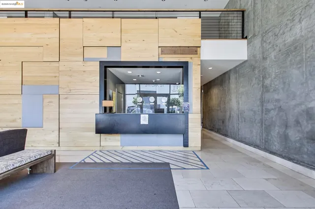 a view of living room kitchen and entryway