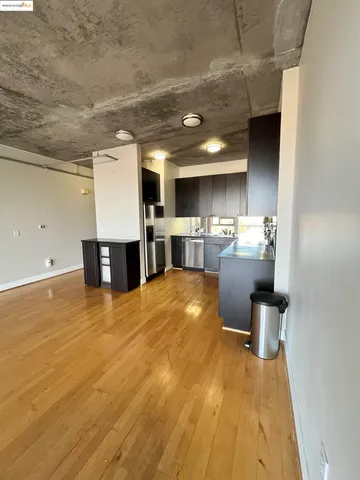 a kitchen with kitchen island a counter top space a sink and appliances