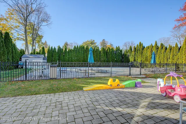 a view of a swimming pool with a lounge chairs