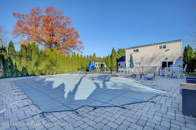 a view of outdoor space with a house in the background